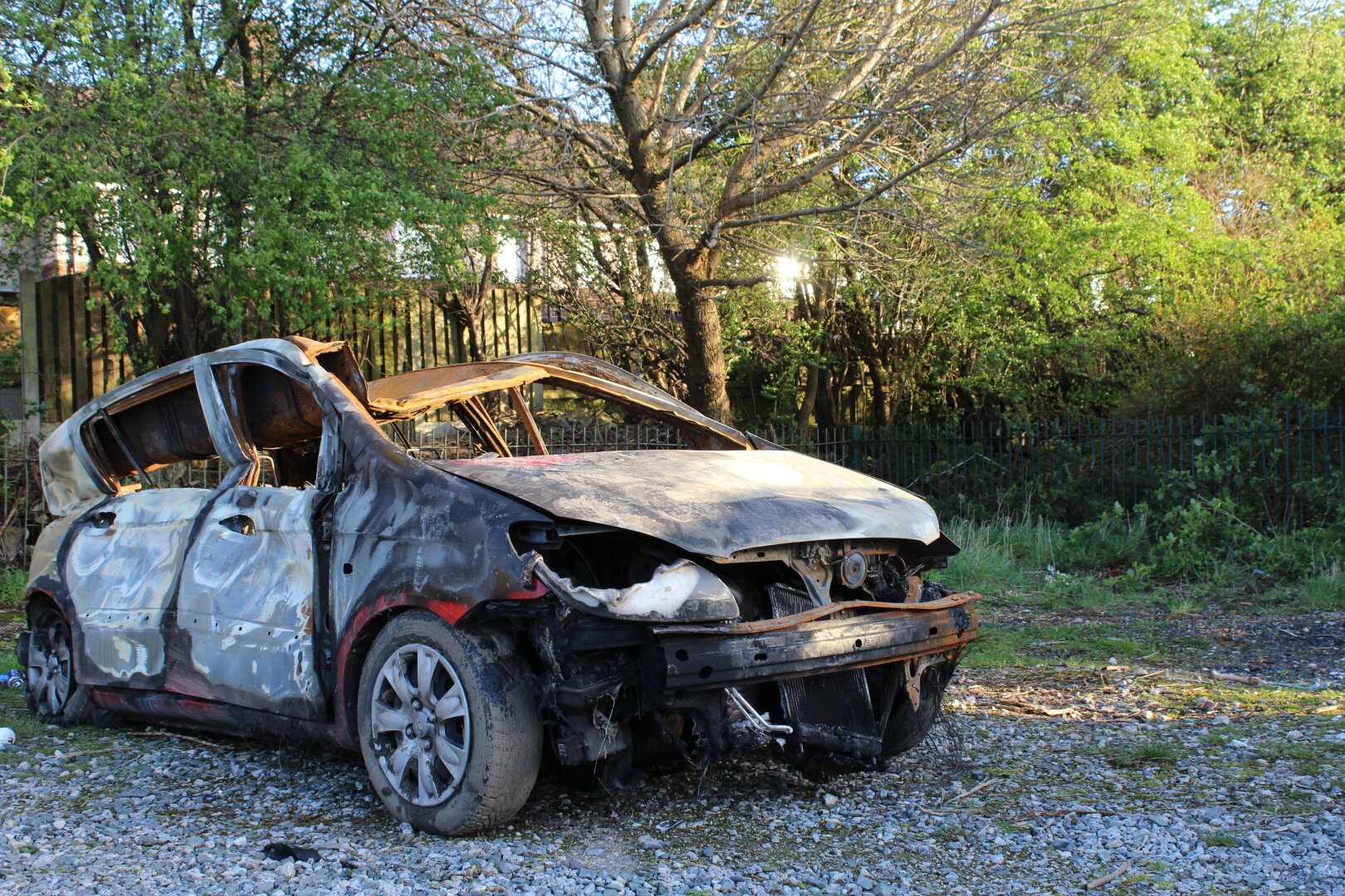 a burned car carcass found in a park in sheffield
