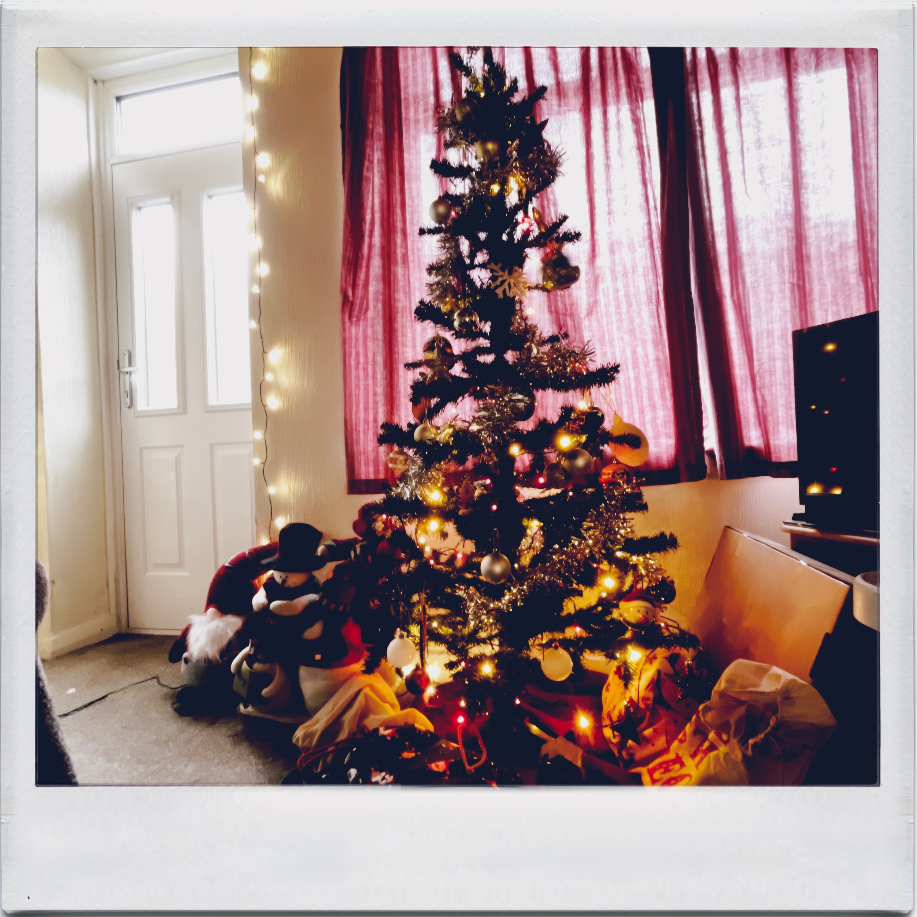 the christmas tree in my living room with a instant camera filter